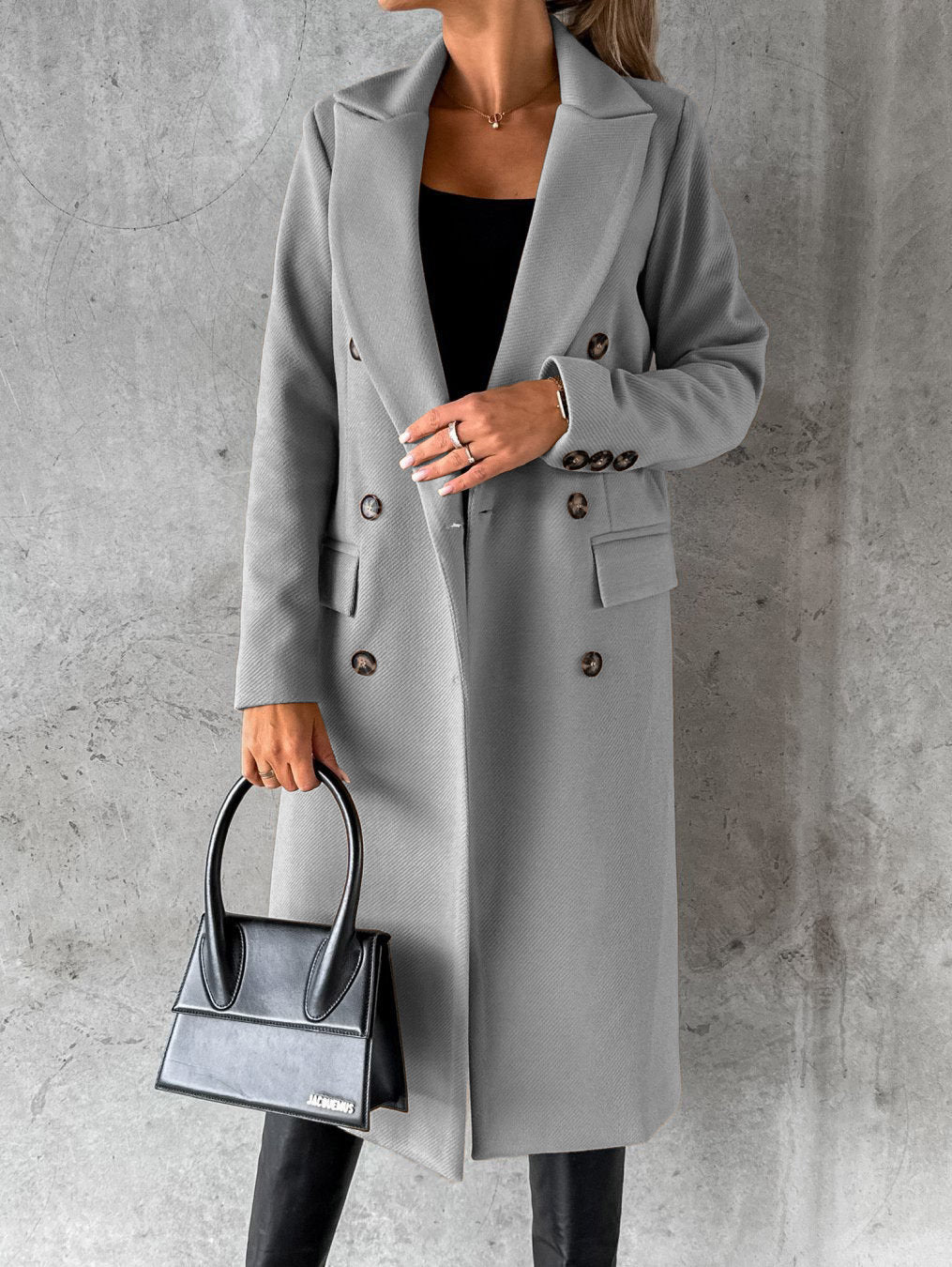 Slate gray longline double-breasted coat with notched lapels and flap pockets