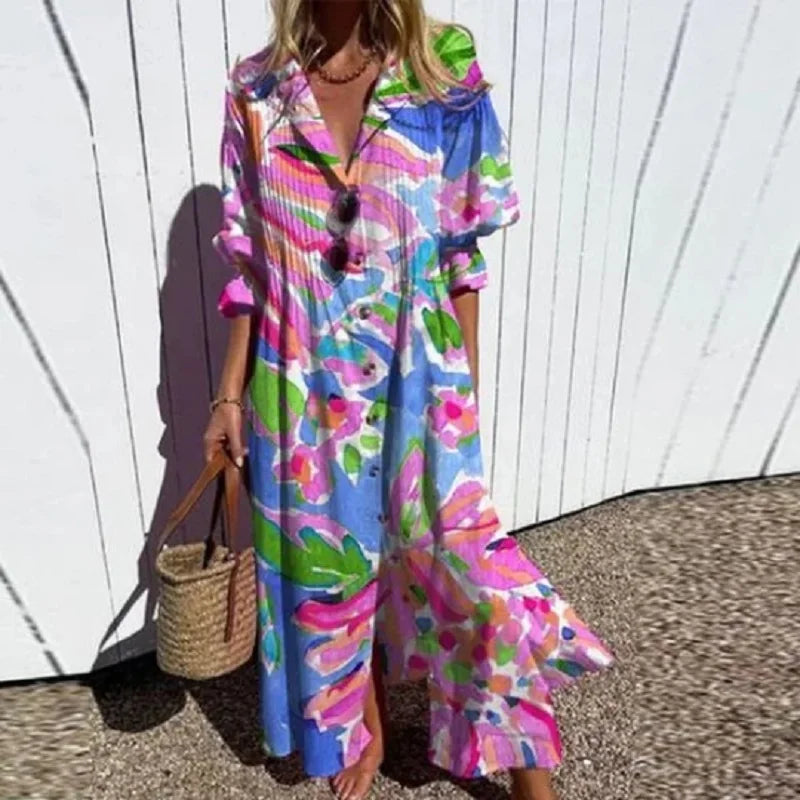 Boho maxi dress with bright blue, pink, green, and purple abstract floral print