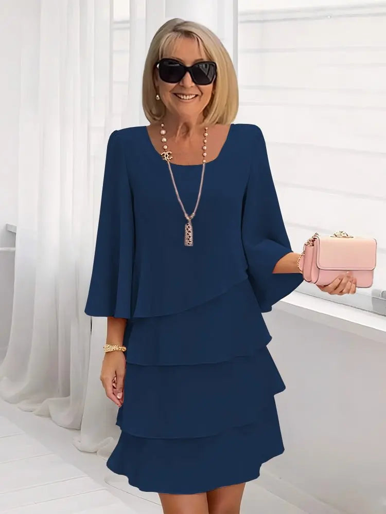 Navy ruffle dress with long bell sleeves and layered tier skirt, scoop neckline