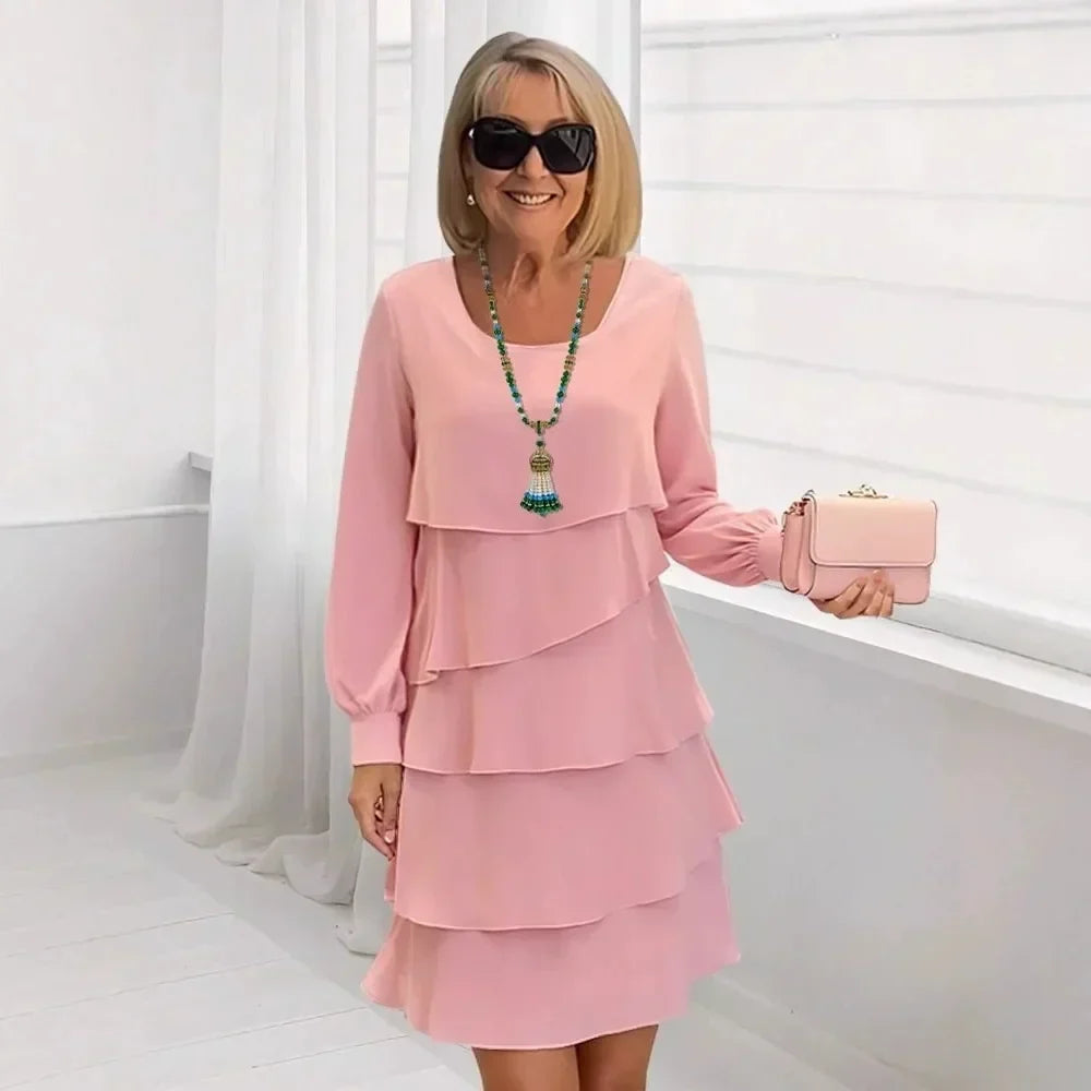 Pink ruffle tier long-sleeve dress with layered skirt, round neckline