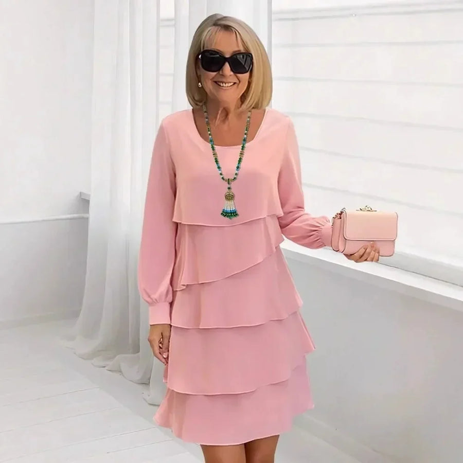 Pink ruffle tier long-sleeve dress with layered skirt, round neckline