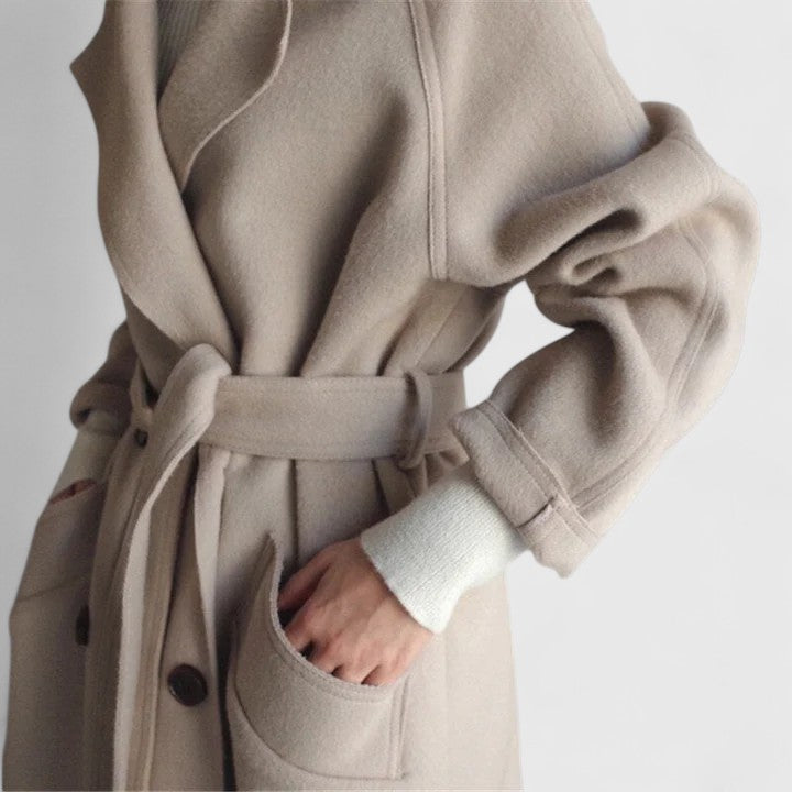 Beige coat with belt tie and front pocket detail, double-breasted buttons