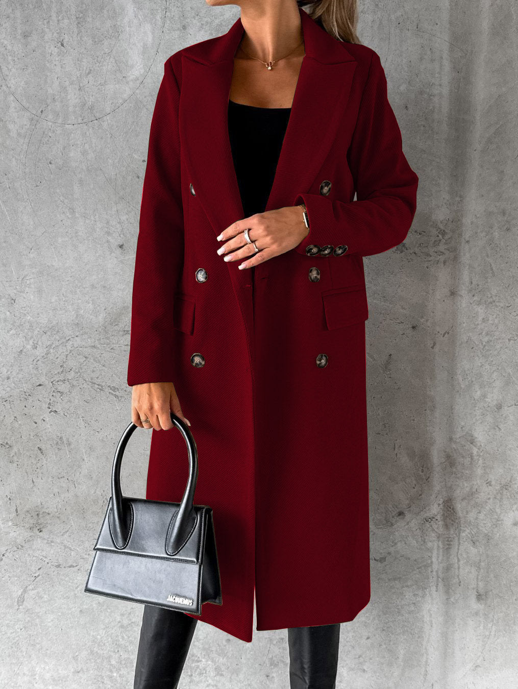 Burgundy longline double-breasted coat with notched lapels and flap pockets
