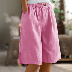 Relaxed summer shorts in pink, elastic waistband and front button, knee length.