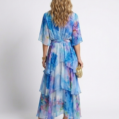 Back view of blue watercolor print tie-waist V-neck maxi dress with layered ruffle tiers