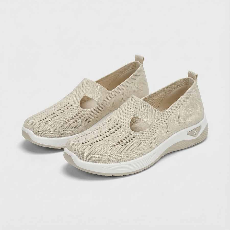 Beige slip-on orthopedic shoes with knit upper, cushioned collar and round toe