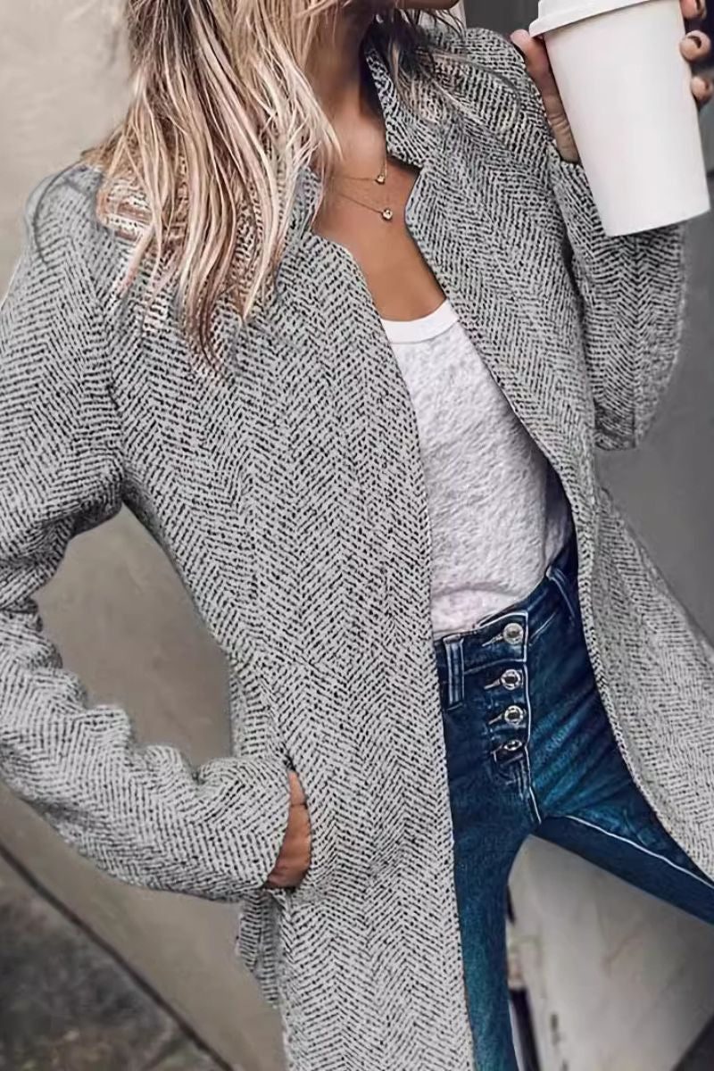Textured gray herringbone blazer, side view with notched lapels