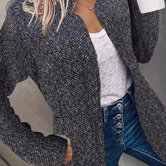 Textured black herringbone blazer with notched lapels and long sleeves