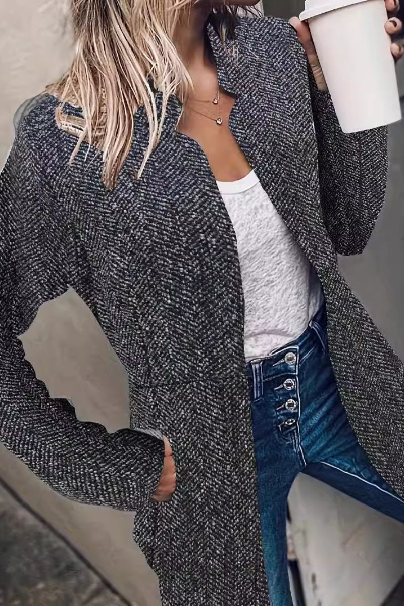 Textured black herringbone blazer with notched lapels and long sleeves