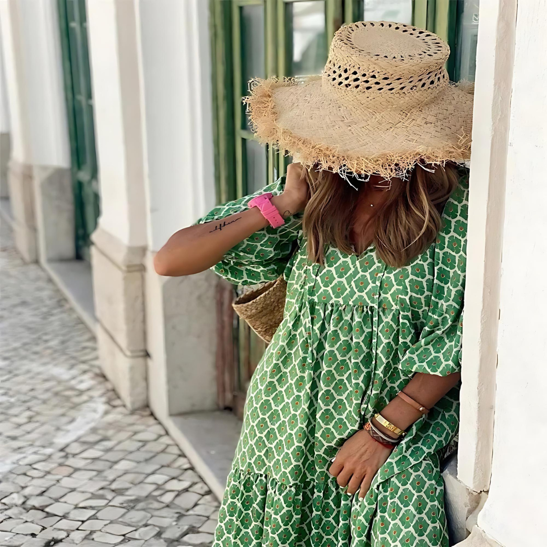 Green boho maxi dress with white geometric print, V-neck and ruffled-tier bodice detail