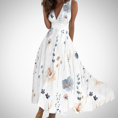 White floral maxi dress with blue and peach blossoms, sleeveless V-neck, gathered waist