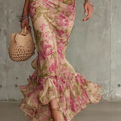 Pink floral maxi dress with ruffled bell hem and gathered detailing at skirt