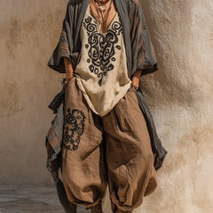Set boho nomad: kimono scuro, tunica crema ricamata e pantaloni ampi marroni