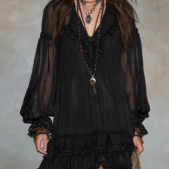 Black mini dress with V-neck, sheer puff sleeves, and tiered ruffle hem.