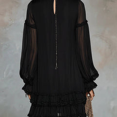 Black mini dress back with keyhole cutout, sheer long sleeves, tiered ruffle hem.