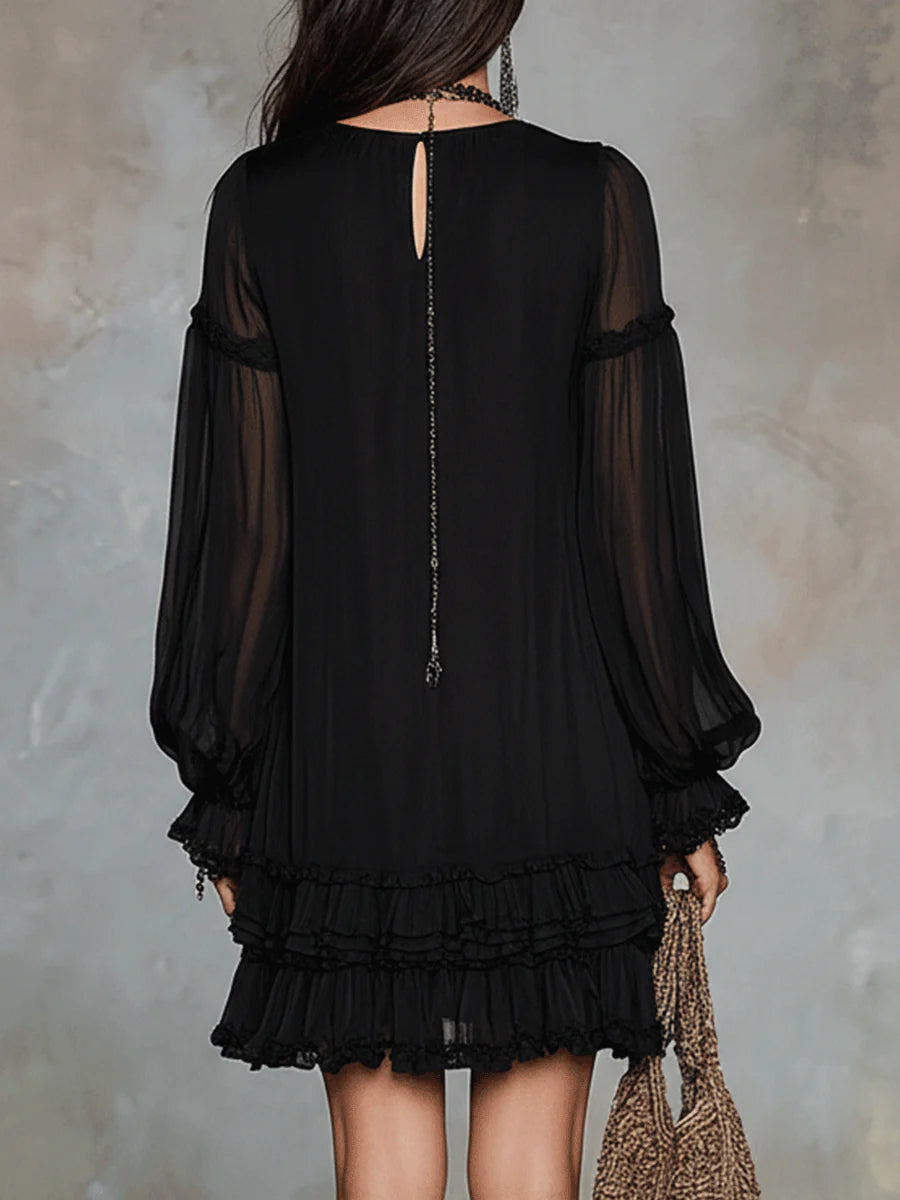 Black mini dress back with keyhole cutout, sheer long sleeves, tiered ruffle hem.