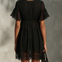 Black mini dress back view with gathered waist and lace hem trim