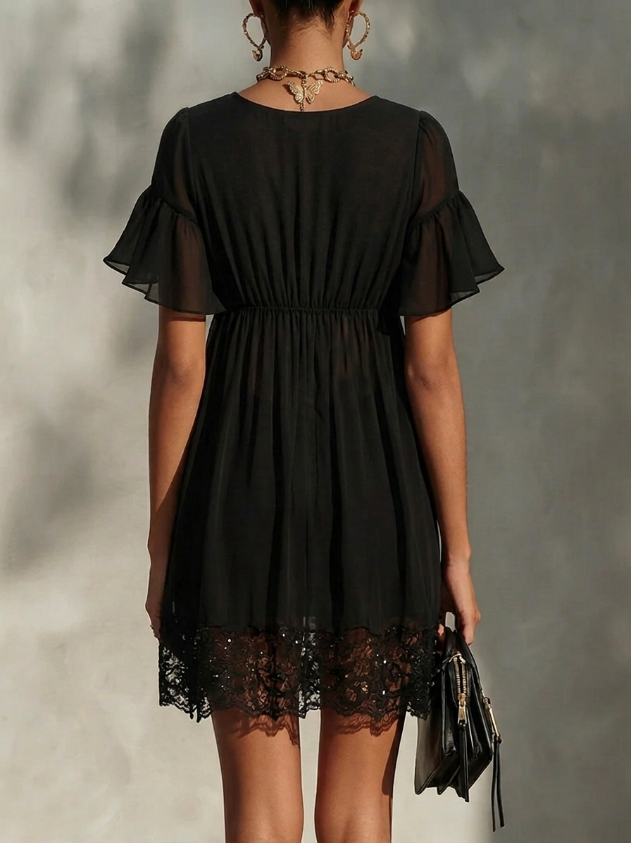 Black mini dress back view with gathered waist and lace hem trim