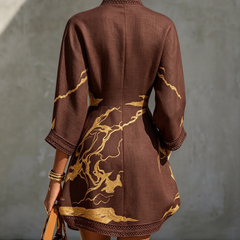 Back view dark brown lace midi dress with gold motif embroidery and lace-trim hem