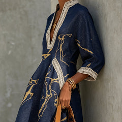 Navy midi lace-trim V-neck dress with gold motif; side view, three-quarter sleeves