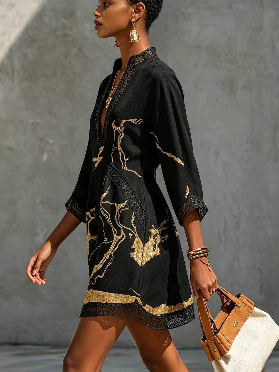 Black lace midi dress in V-neck style with gold abstract pattern and lace-trim hem