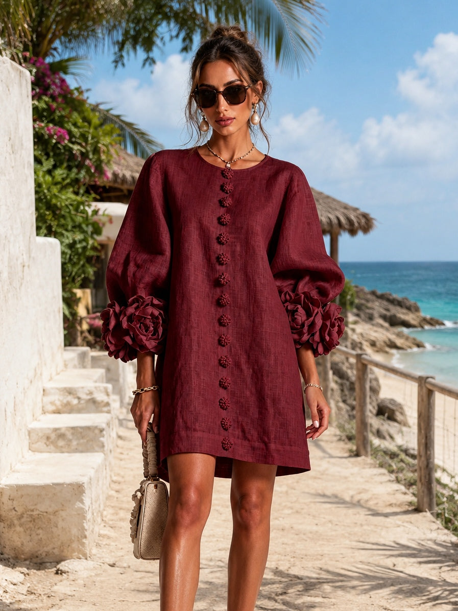 Burgundy midi dress with long puff sleeves, rosette cuffs, and embroidered center placket