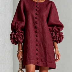 Burgundy button-front mini dress with embroidered front placket and rosette puff sleeve details.