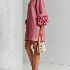 Dusty rose button-front midi dress with rosette sleeve cuffs and short button placket