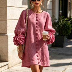 Mauve pink button-front midi dress with round neckline and rosette cuff details