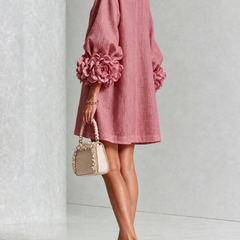 Dusty rose button-front midi dress, side view, with rosette puff sleeves and buttons