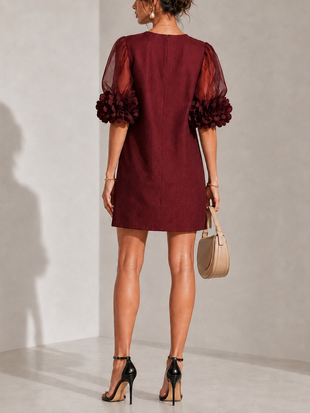 Burgundy mini dress with sheer puff sleeves and gathered back yoke seam