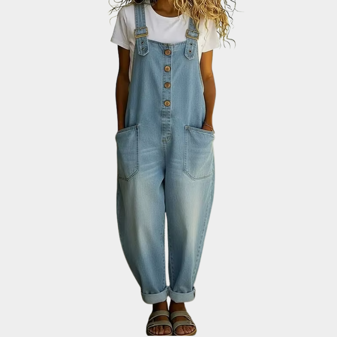 Light blue denim overalls with adjustable straps, front buttons, and side patch pockets.