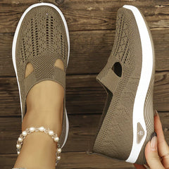 Beige knit slip-on sneakers with side cutouts and white cushioned soles