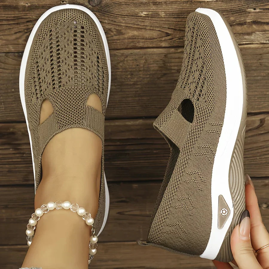 Beige knit slip-on sneakers with side cutouts and white cushioned soles
