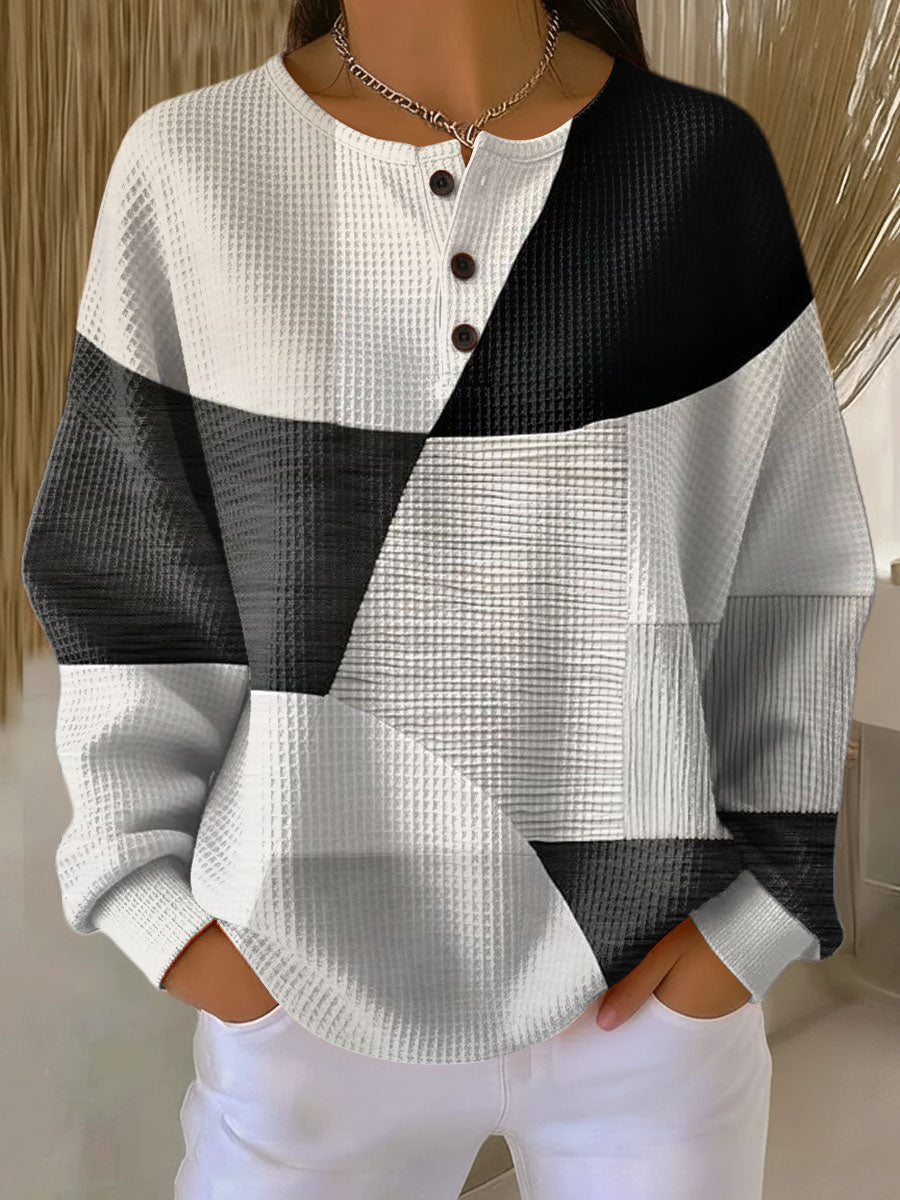 White and dark gray patchwork knit sweater, long sleeves, henley button front