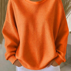 NYLA classic sweater in orange waffle-knit, crewneck, long sleeves with ribbed cuffs.
