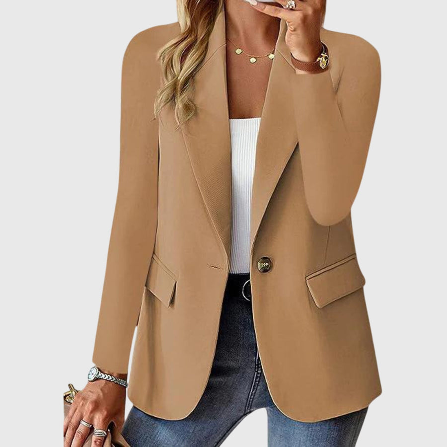 Beige blazer with notch lapel, single-breasted button closure, flap pockets.