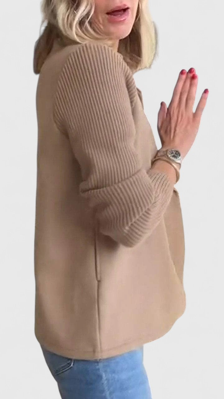 Beige knit blazer jacket with notched lapels and dark buttons