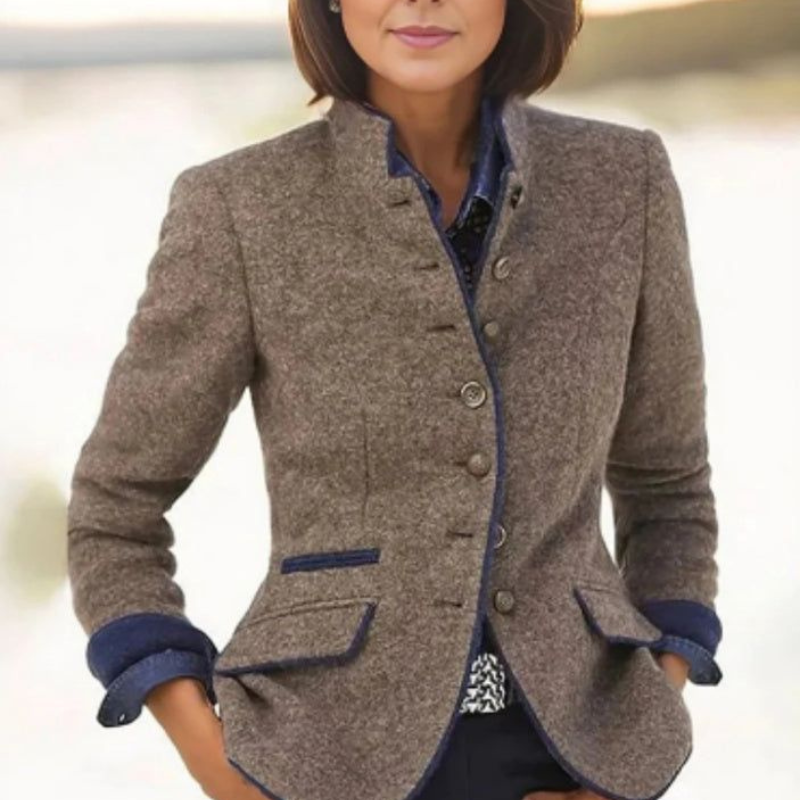 Women's textured blazer with button front, flap pockets, and blue trim
