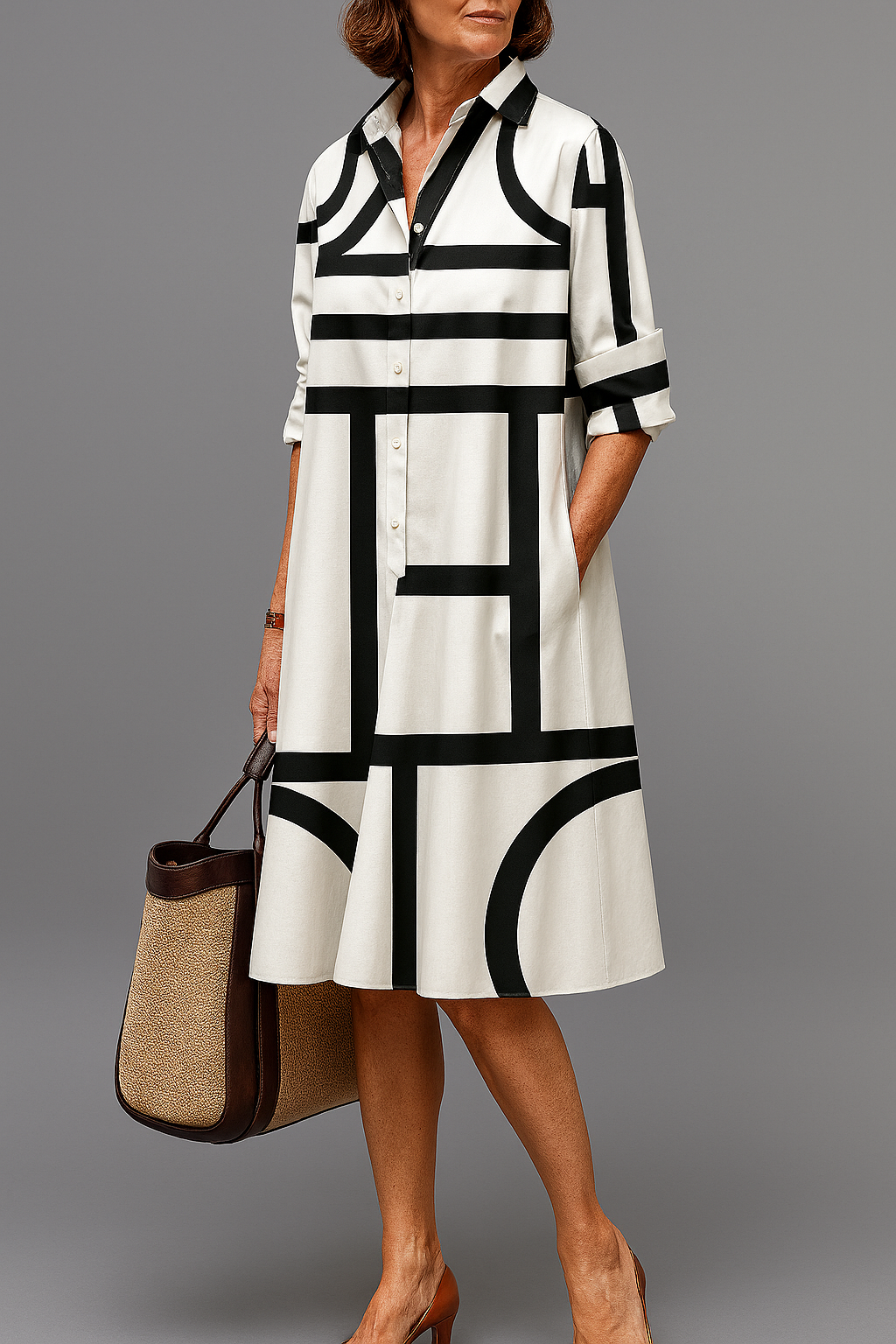 Black-and-white striped midi shirt dress with collared neckline, button front, and 3/4 sleeves