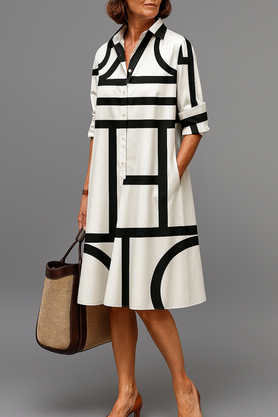 Black-and-white striped midi shirt dress with collared neckline, button front, and 3/4 sleeves