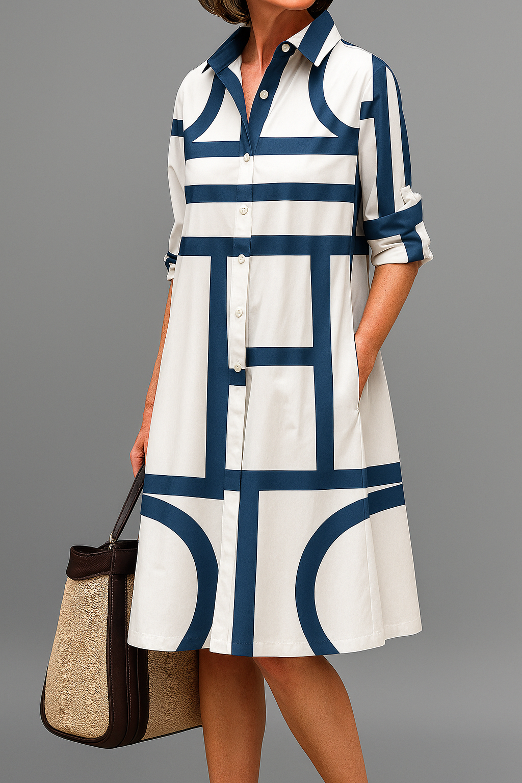 Stylish midi dress in white with navy geometric pattern, button-up, collared shirt style