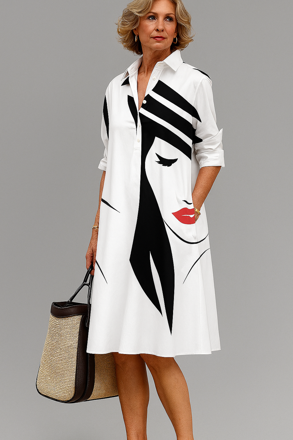 White midi dress with bold black face pattern, button-up collar, 3/4 sleeves