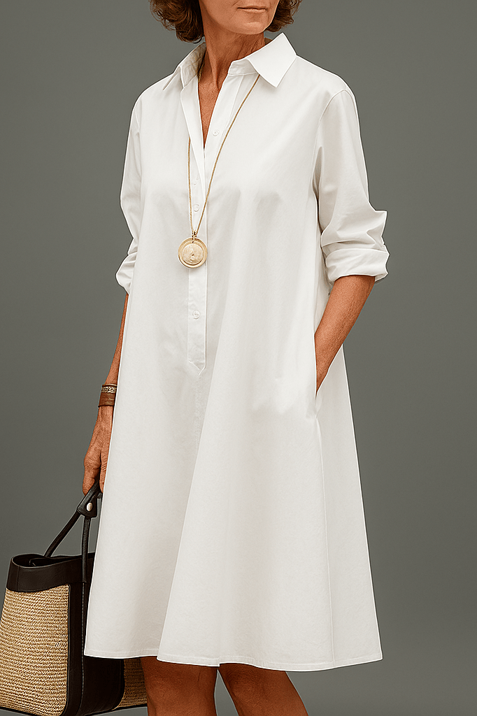 White midi dress with button-up shirt collar, 3/4 sleeves, and a loose A-line fit