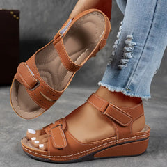 Brown supportive wedge sandals with two buckled straps and open toe