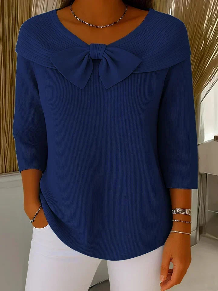 Dark blue sweater with round neckline bow and three-quarter sleeves