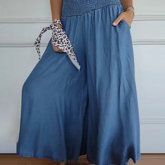 Blue relaxed-fit trousers with elastic waist, wide legs and side seam detail