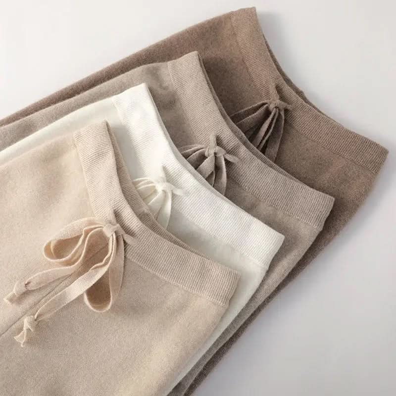Light knit pants close-up: white, beige, and taupe waistbands with drawstrings.