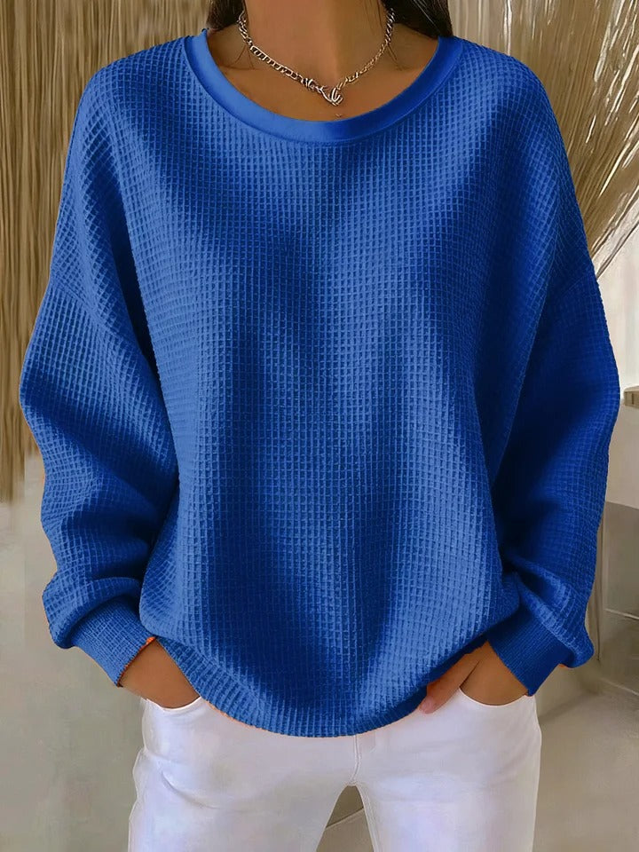 NYLA classic sweater in blue waffle-knit, crewneck, long sleeves with ribbed cuffs.
