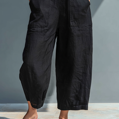 Pantalone tuta fluida nera con tasche cargo e gamba ampia